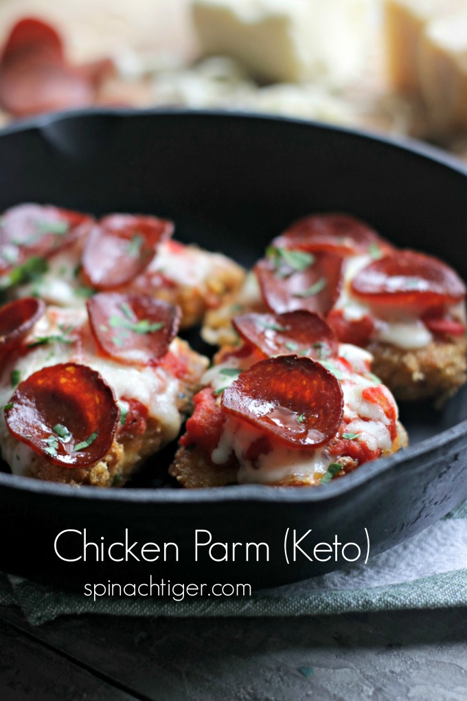 Keto Chicken Parmesan with Pork Panko. Low Carb, paleo, gluten free. #chickenparm #lowcarbparmesan #ketochickenparmesan #pepperoni #ketochickenrecipe #ketoItalianrecipe #spinachtiger