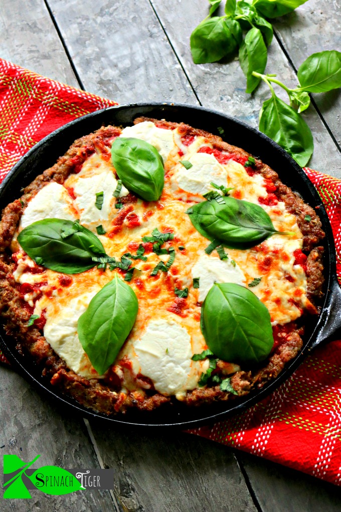 Keto Sausage Crusted Three Cheese Pizza with Fresh Basil from Spinach Tiger