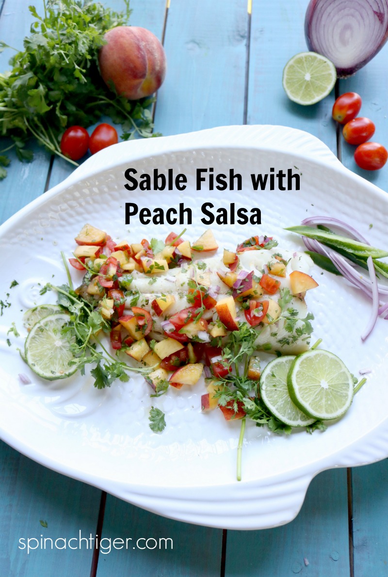 Wild Alaskan Roasted Sable Fish with Fresh Peach Salsa from Sitka Salmon Shares. Peaches cut through this buttery, delicate mild tasting fish for a clean, healthy decadent meal. #sablefish #roastedfish #peaches #peachsalsa #spinachtiger #sitkasalmnshares. via @angelaroberts