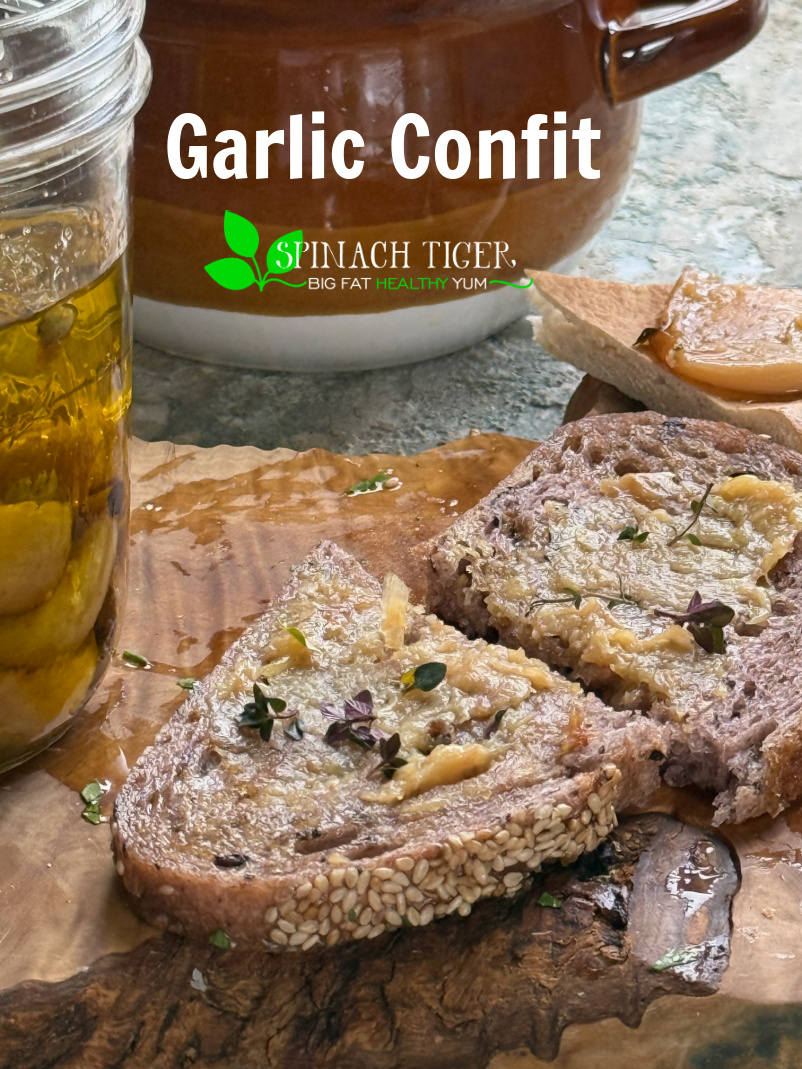 Garlic Confit. Enjoy soft, creamy, delicious garlic baked in olive oil. Spread on bread, put in soups/stews, veggies. Make dips. via @angelaroberts